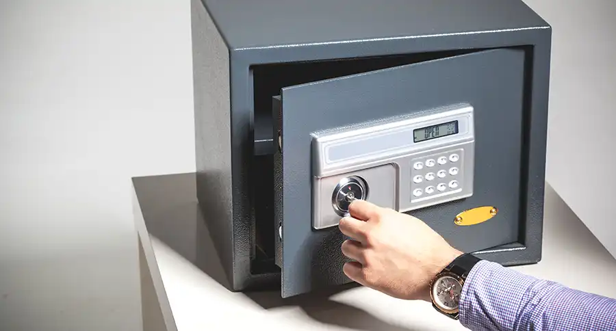A person opening a digital safe.